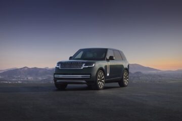 Range Rover Electric front three quarter at dusk
