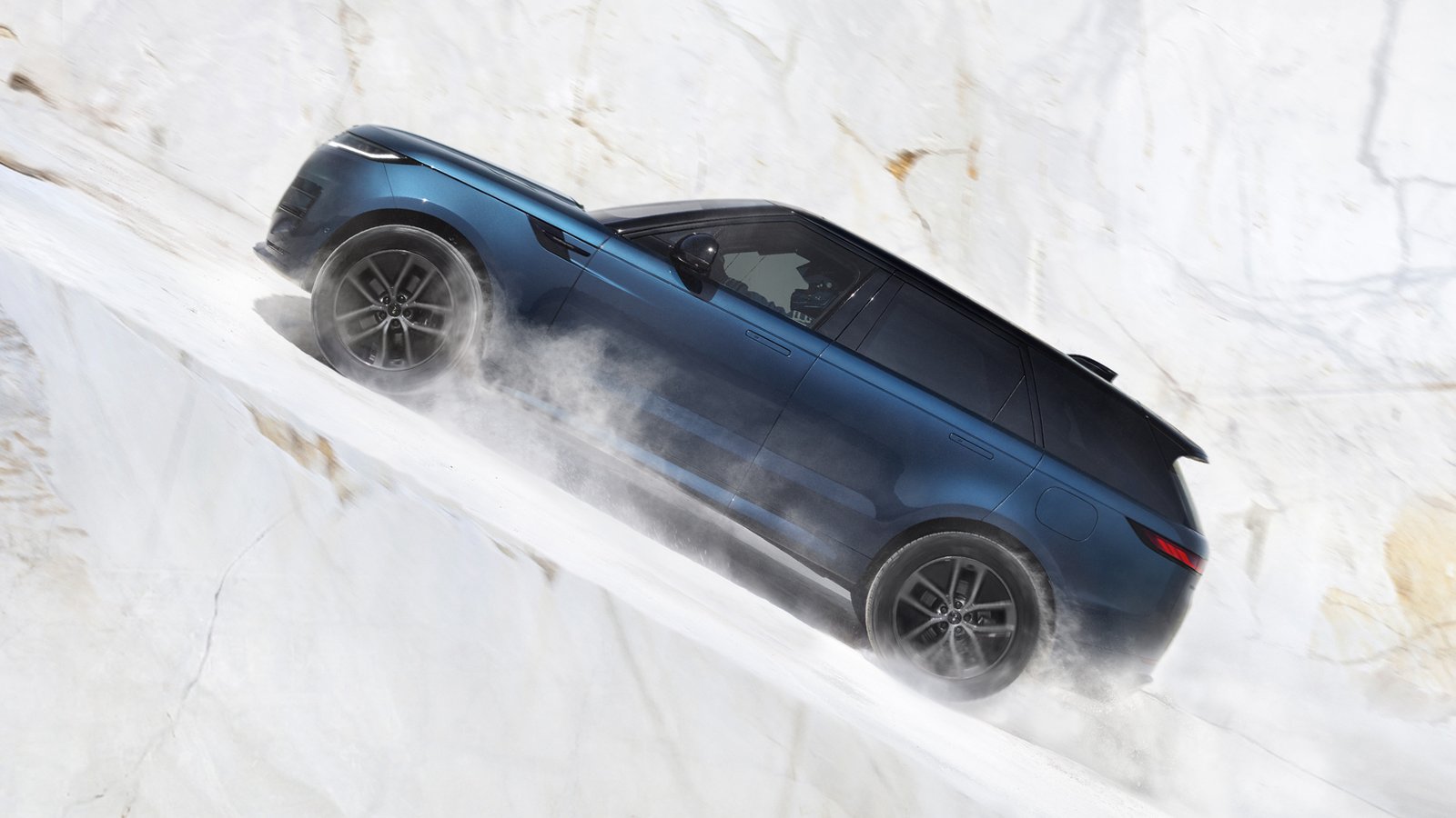 Blue Range Rover Sport Electric descending a steep marble slope