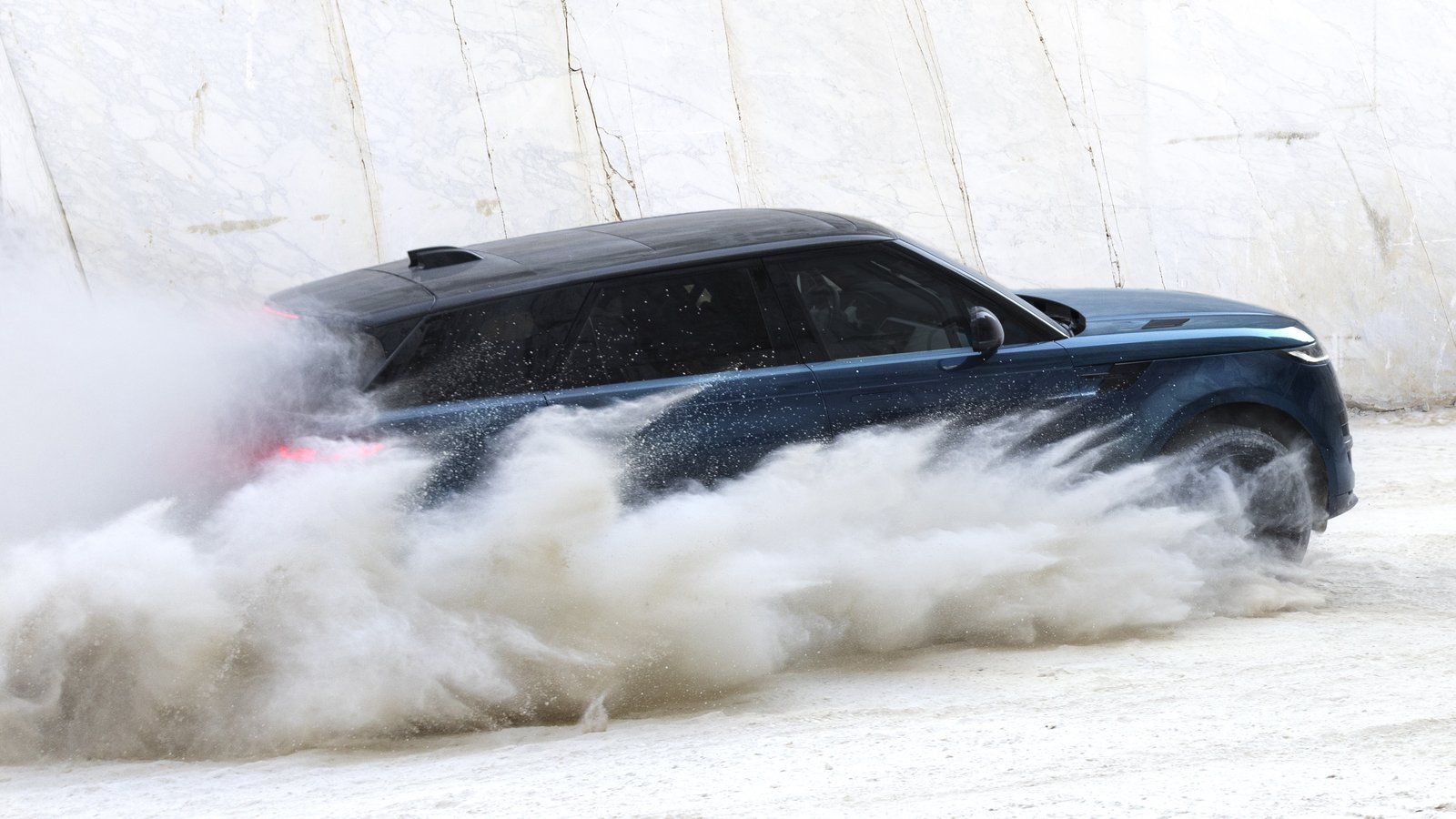 Blue Range Rover Sport Electric kicking up marble dust