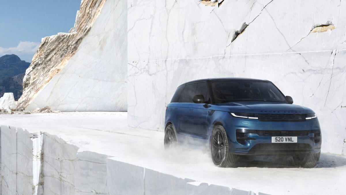 Blue Range Rover Sport Electric driving through a white marble quarry