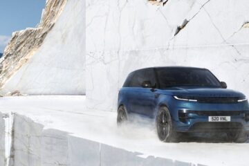 Blue Range Rover Sport Electric driving through a white marble quarry