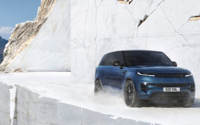 Blue Range Rover Sport Electric driving through a white marble quarry