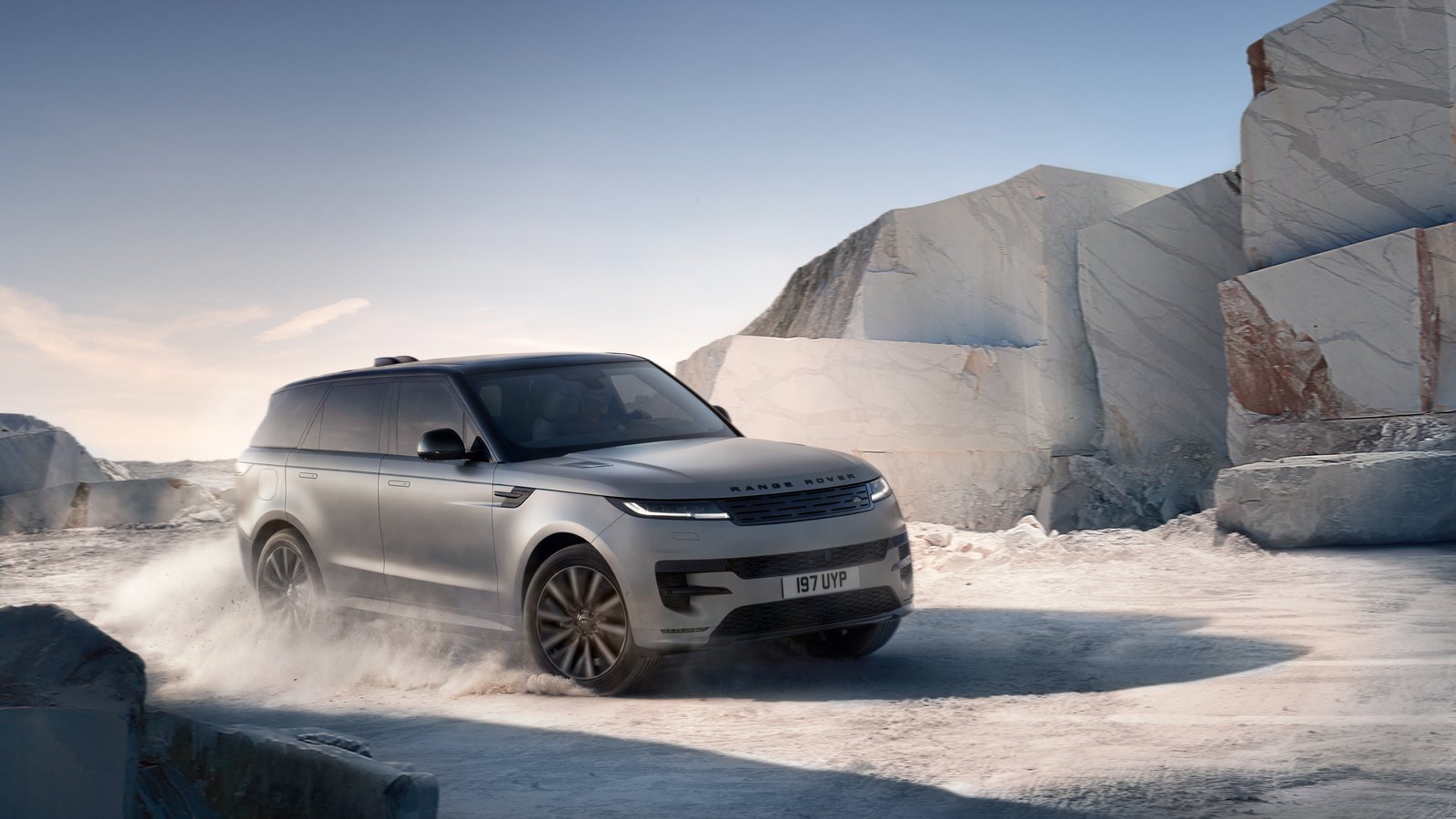 Grey Range Rover Sport Electric driving on a marble quarry track
