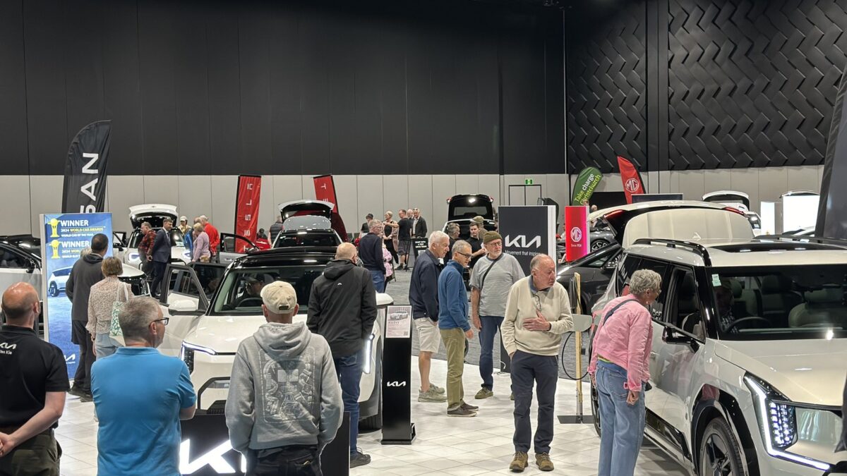 Visitors looking at electric vehicles on display at a previous Take Charge Expo at Te Pae Christchurch