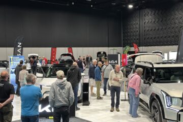 Visitors looking at electric vehicles on display at a previous Take Charge Expo at Te Pae Christchurch