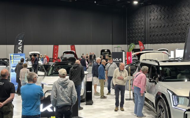 Visitors looking at electric vehicles on display at a previous Take Charge Expo at Te Pae Christchurch