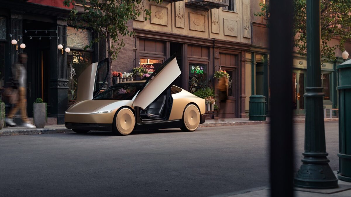 Tesla Cybercab with its dihedral doors open on a city street