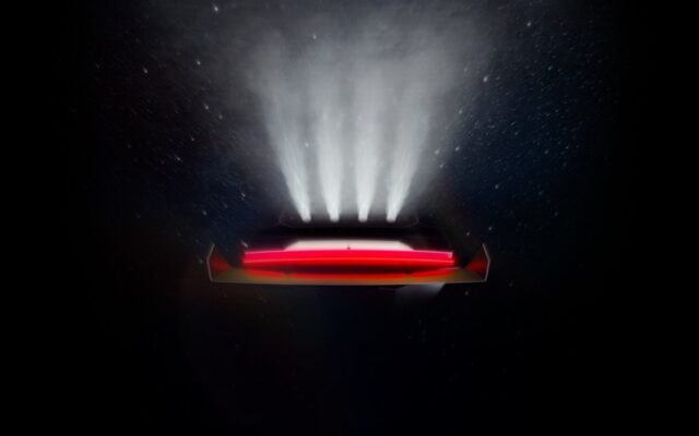 Tesla Roadster teaser image showing the rear of the car upside down with four thruster plumes against a starfield