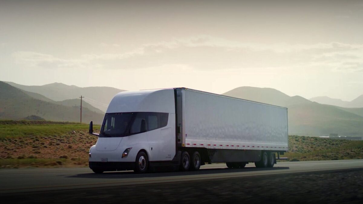 Tesla Semi with trailer driving on a highway