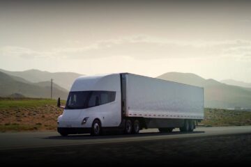 Tesla Semi with trailer driving on a highway