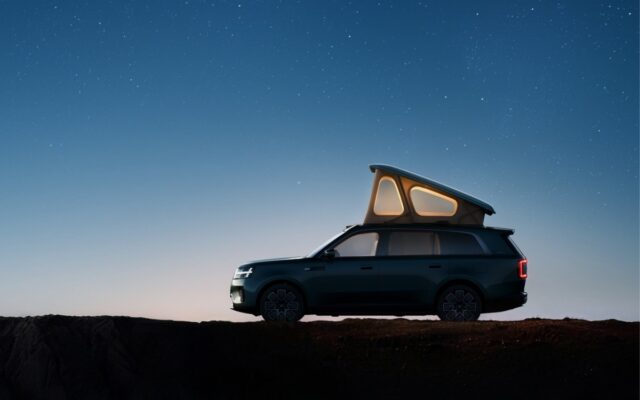 Xiaomi Skynomad N90 Max Studio at night with its pop-up roof raised and lit
