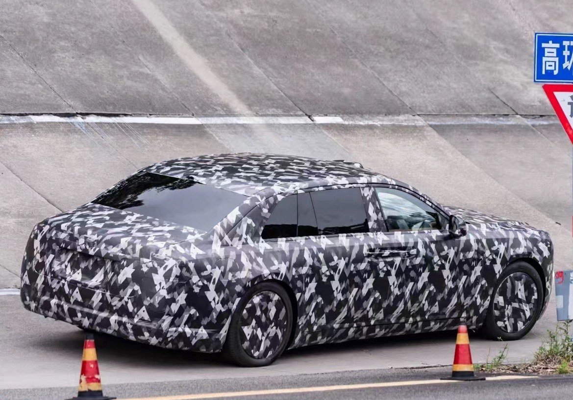 Camouflaged Yangwang sedan from the rear