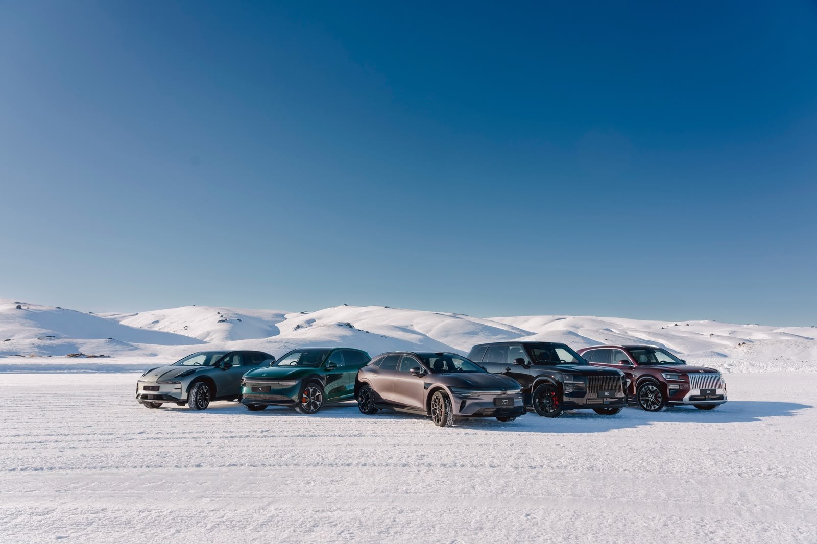 Zeekr models lined up on snow at Cardrona