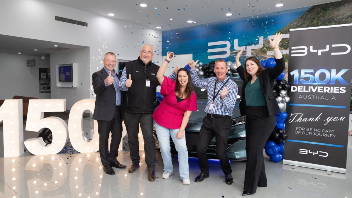 BYD staff celebrate Australia’s 150,000th BYD delivery, a Seal 6 Touring, at BYD Warrnambool