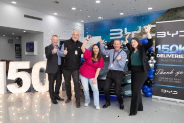 BYD staff celebrate Australia’s 150,000th BYD delivery, a Seal 6 Touring, at BYD Warrnambool