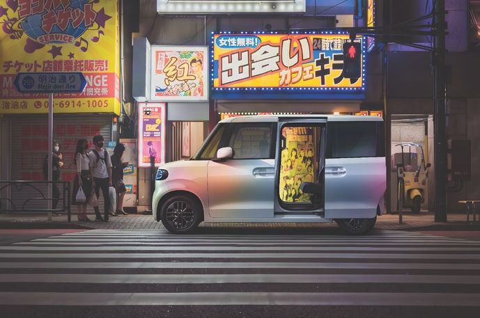 BYD Racco with its sliding door open at a pedestrian crossing