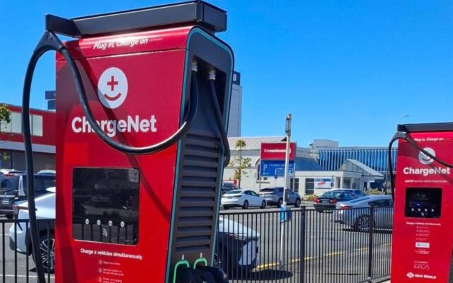 Two red ChargeNet hyperchargers at a New World car park