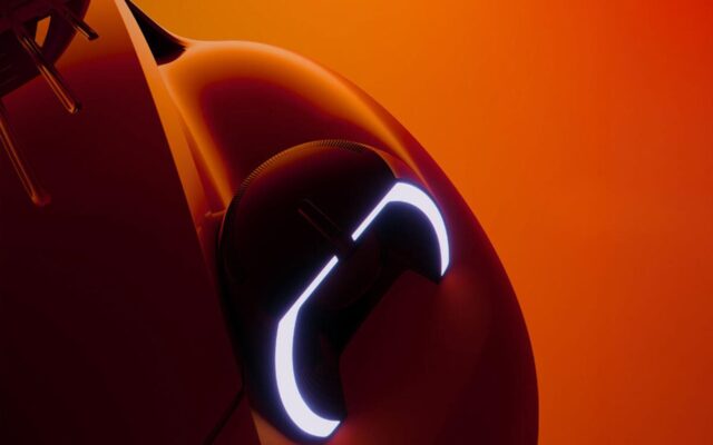 Dome-shaped LED headlight on the front wing of the electric Citroen 2CV
