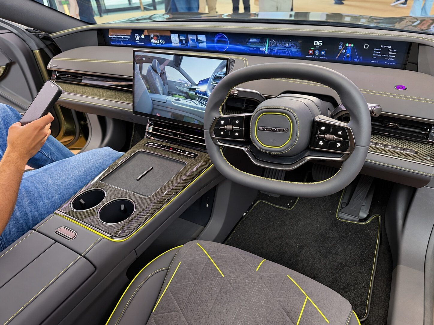 Right-hand-drive Exlantix ES GT dashboard with full-width display and carbon fibre console