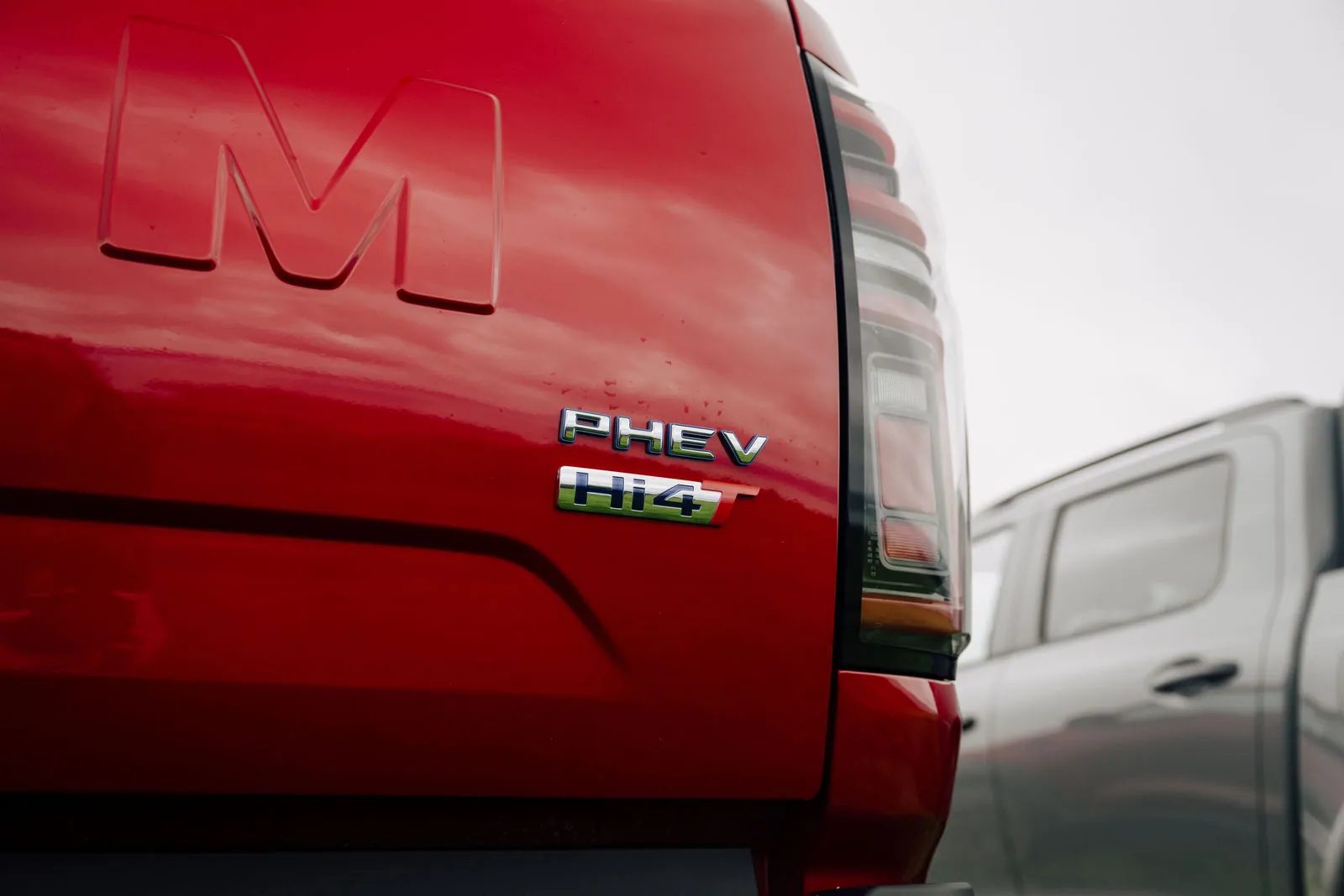 PHEV and Hi4-T badges on the tailgate of a red GWM Cannon