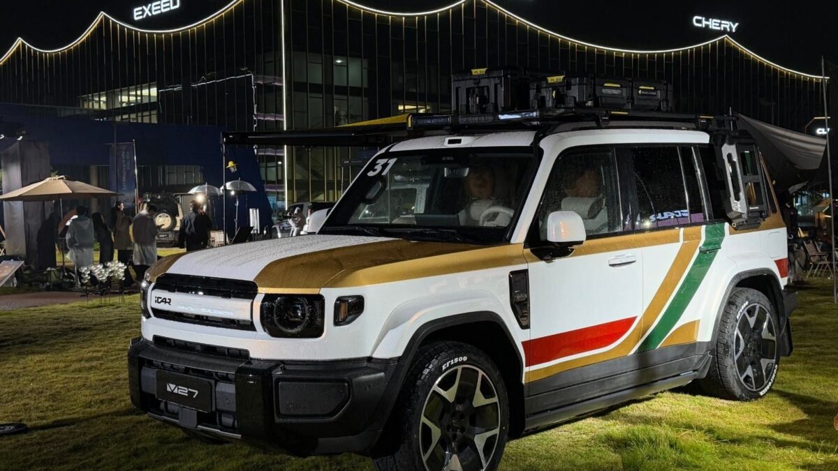 White iCAUR V27 with roof boxes and awning outside Chery headquarters in Wuhu