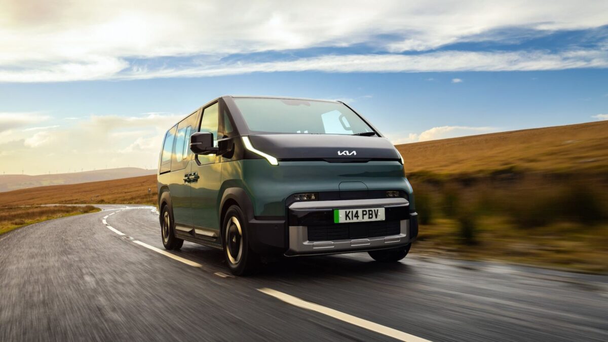 Kia PV5 Passenger electric van driving on a country road