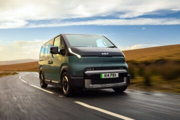 Kia PV5 Passenger electric van driving on a country road