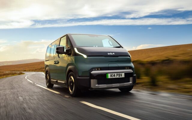 Kia PV5 Passenger electric van driving on a country road