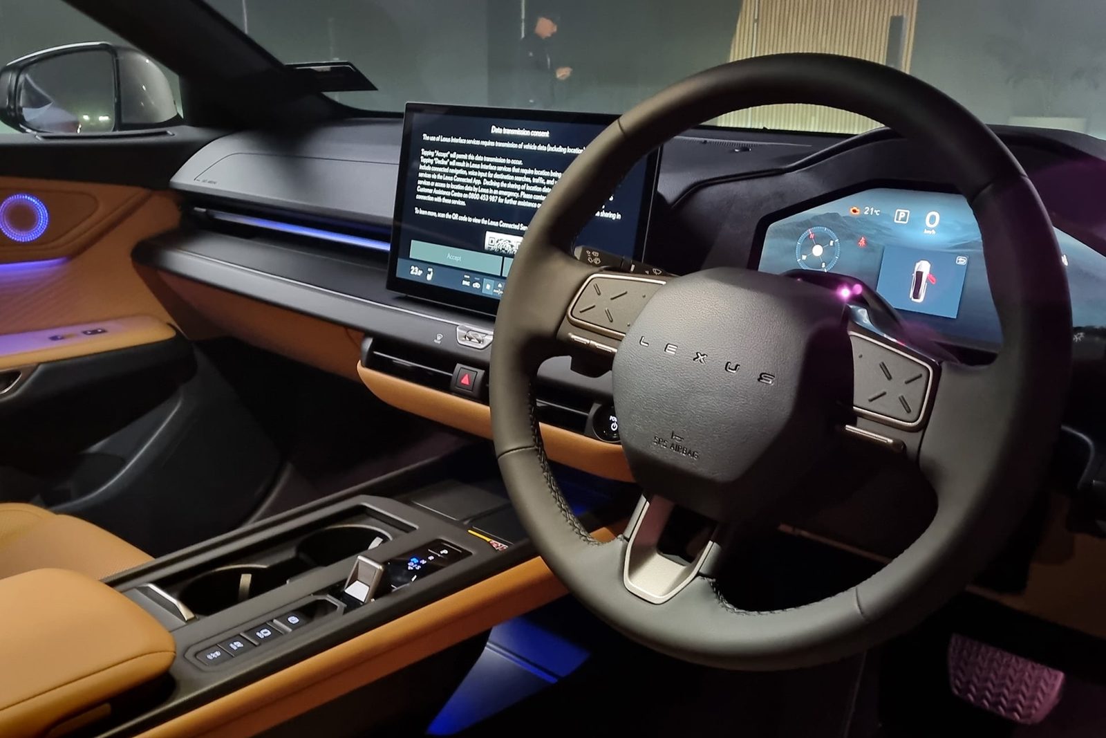 Dashboard of the new Lexus ES with tan trim and ambient lighting