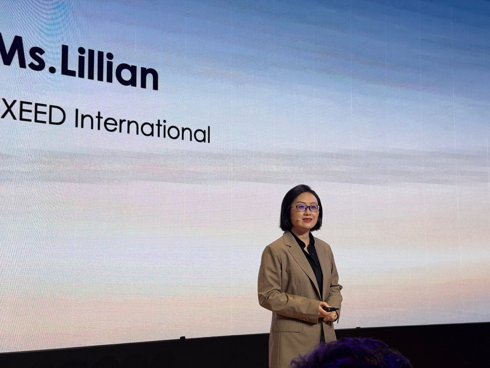 Lilian Xiong, CEO of Exeed and Exlantix International, speaking in Shanghai