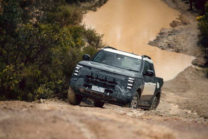 Nissan Navara Pro PHEV prototype beside a muddy pond