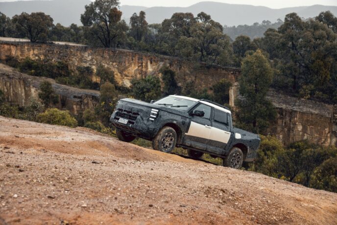 Nissan Navara Pro PHEV prototype side view on a slope