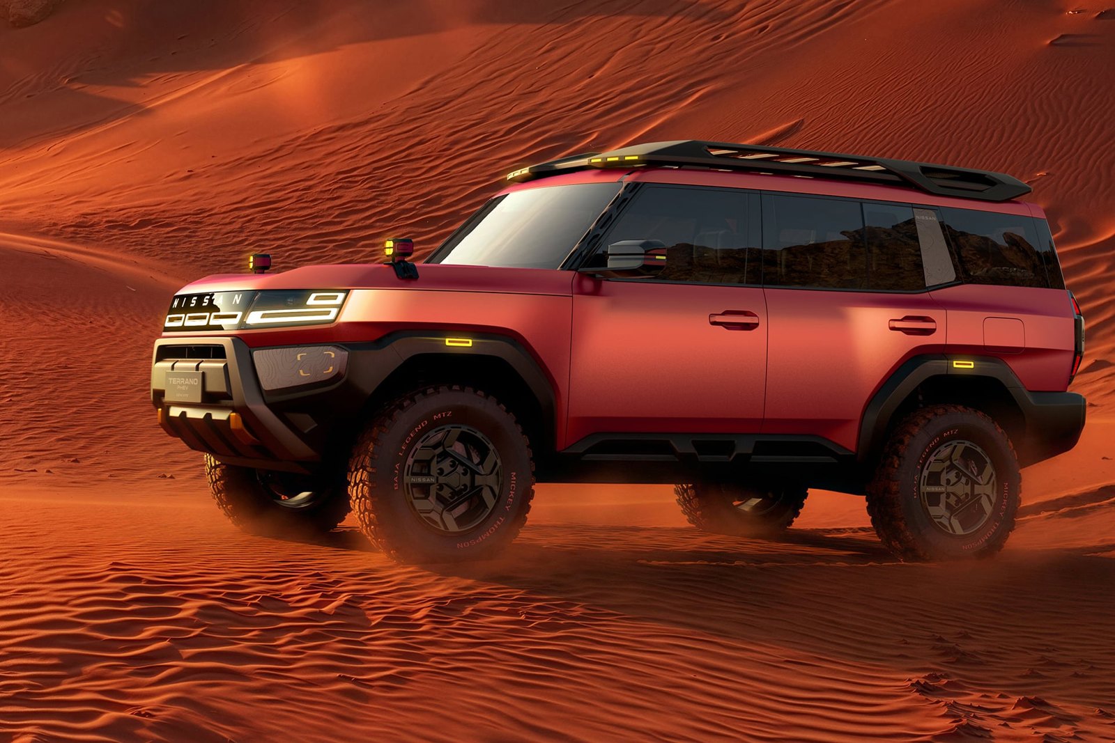 Red Nissan Terrano PHEV Concept driving on sand dunes