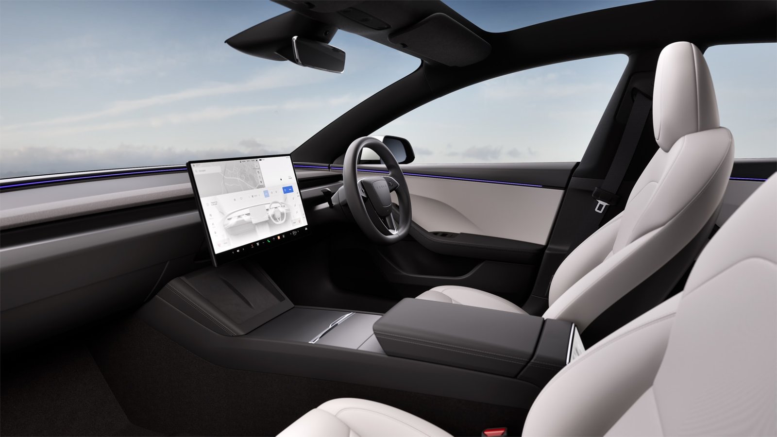 Light interior of a right-hand-drive Tesla Model 3 with its 16-inch touchscreen
