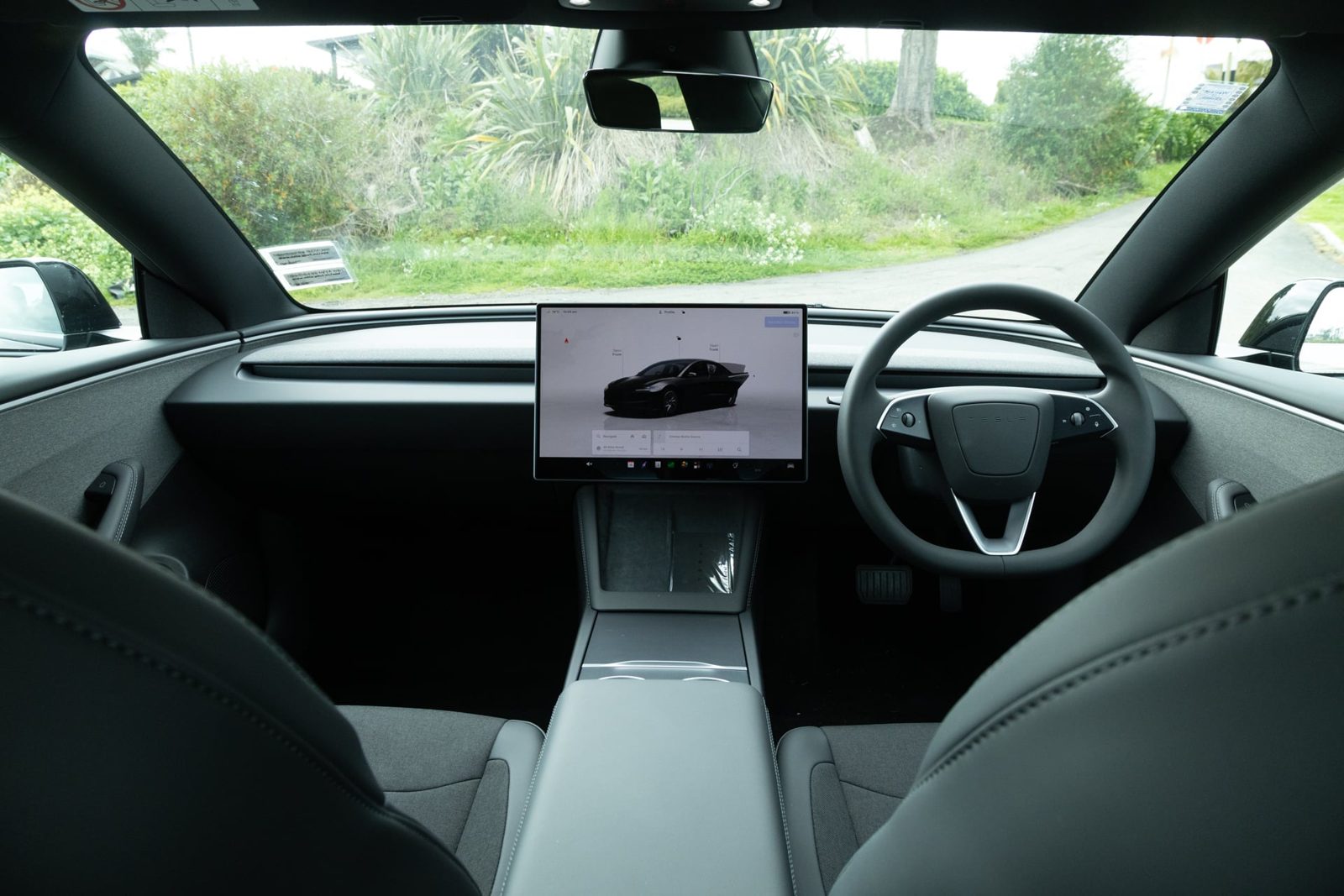 Tesla Model 3 Rear-Wheel Drive dashboard with 16-inch touchscreen and steering wheel