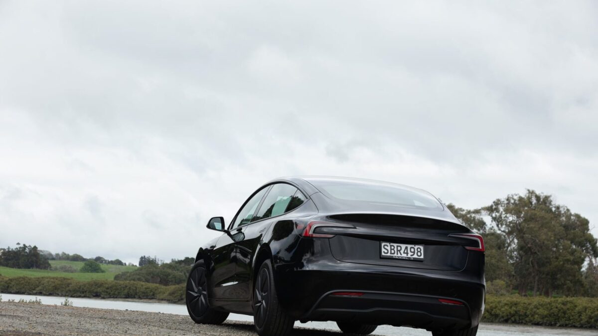 Rear three-quarter view of the black Tesla Model 3 Rear-Wheel Drive