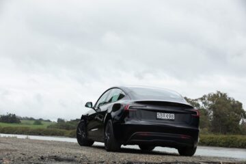 Rear three-quarter view of the black Tesla Model 3 Rear-Wheel Drive