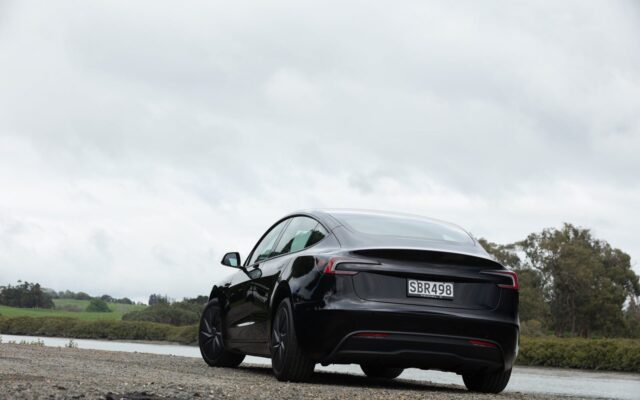 Rear three-quarter view of the black Tesla Model 3 Rear-Wheel Drive