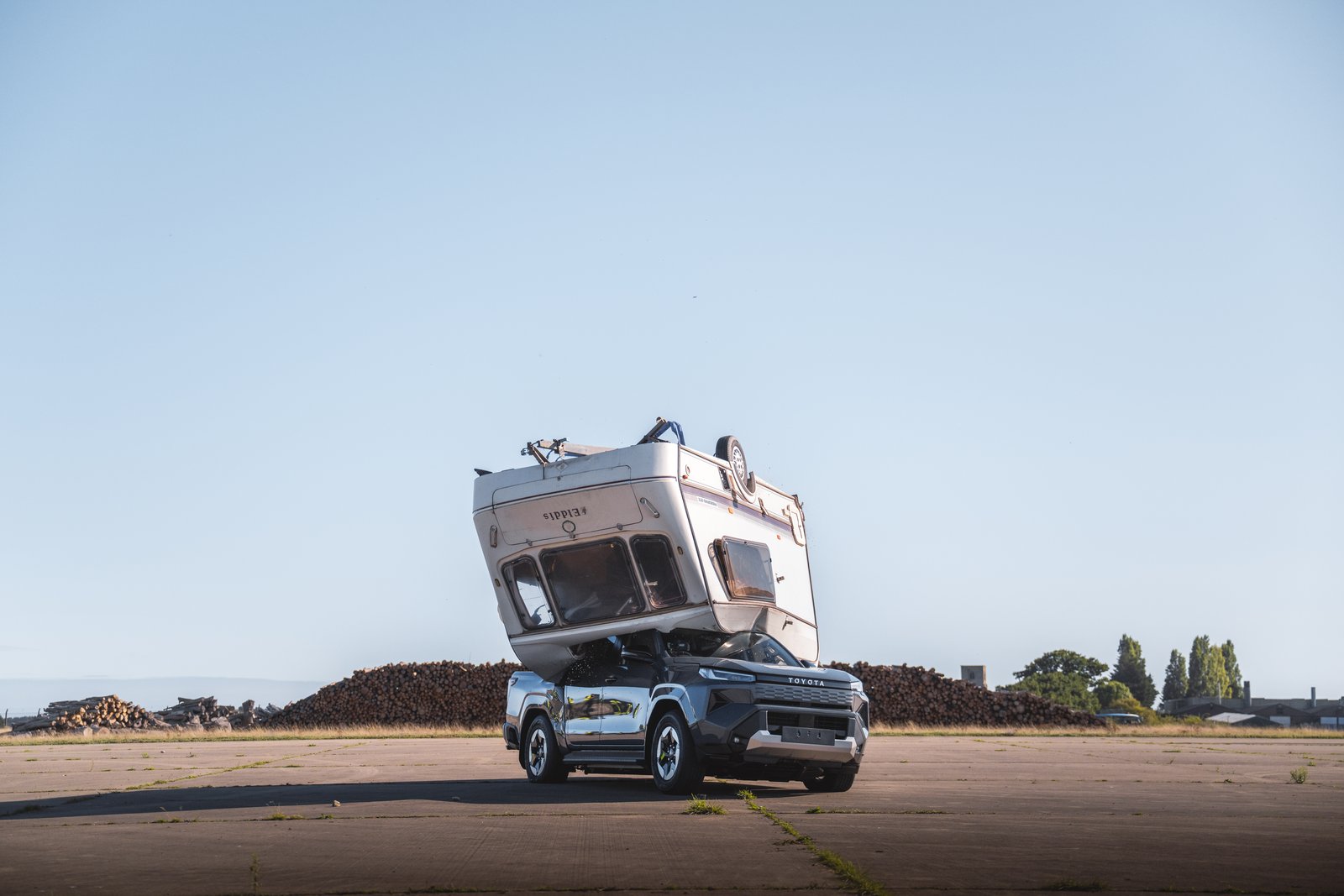 Caravan resting on the roof of the Toyota Hilux BEV after the drop