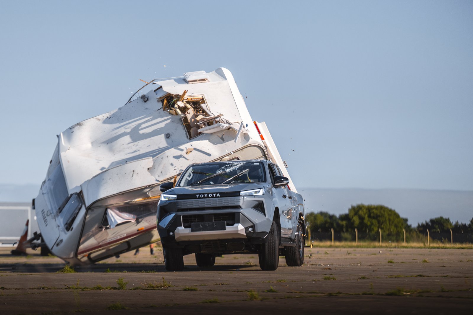 Wrecked caravan beside the Toyota Hilux BEV