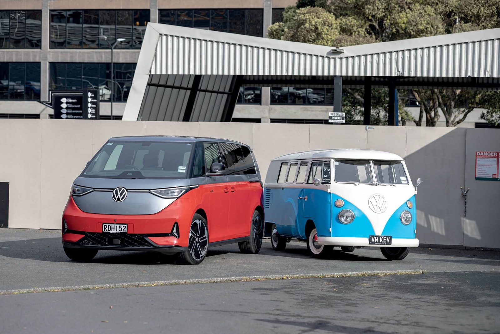 Volkswagen ID. Buzz parked alongside a classic Kombi