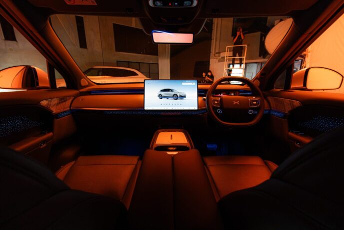 Right-hand-drive XPeng G9L dashboard with tan trim