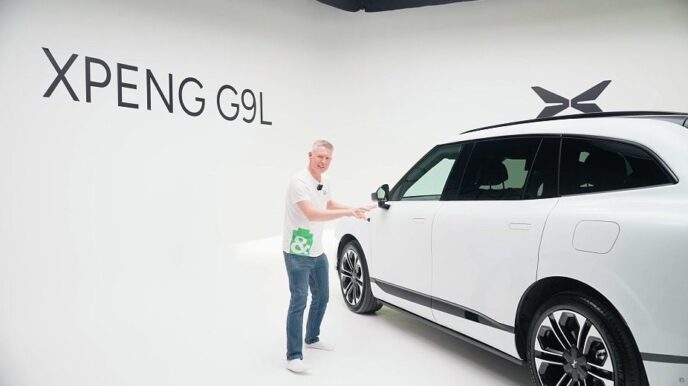 EVs and Beyond EV editor Gavin Shoebridge with a white XPeng G9L