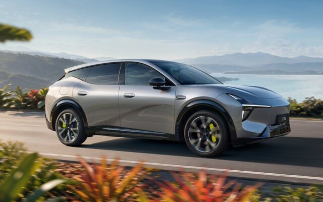 Silver XPeng L05 SUV driving on a coastal road