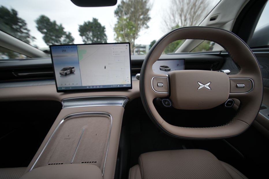 XPeng X9 dashboard, squared-off steering wheel and central touchscreen